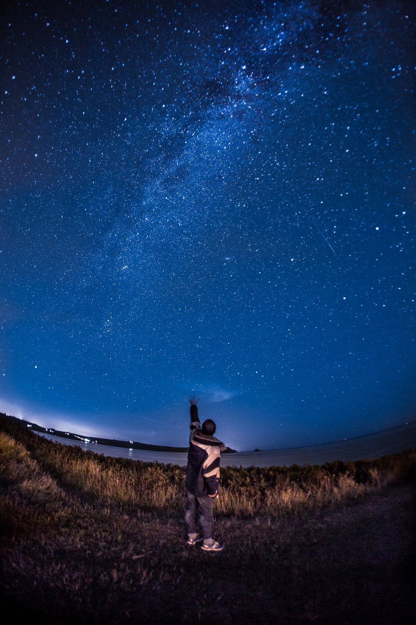 Man and child stargazing